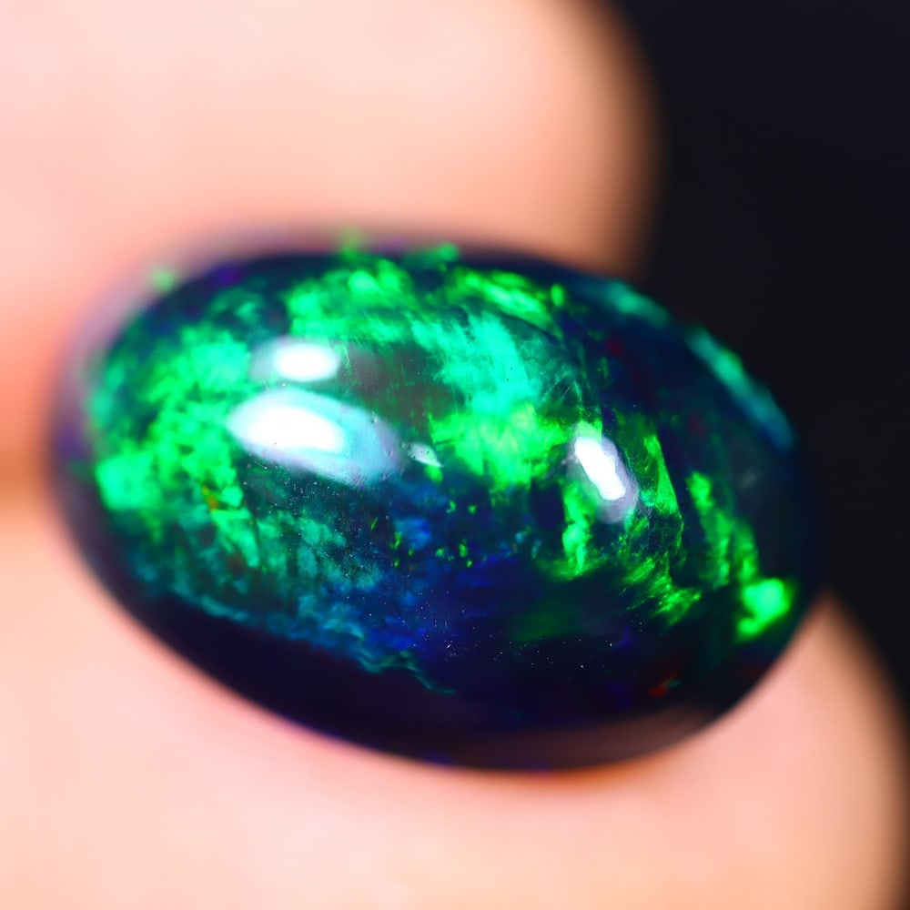 *7.99Ct Welo Black Opal Polished - Ethiopian Opal - Oval Cabochon , 59E: Ksmith Heritage Auctioneers Subject: Natural Ethiopian Welo Black Opal Origin: Ethiopia Carat Weight: 7.99Ct Dimension: 17.2 x 11.8 x 8.1 mm Treatment: Smoked Shape: Oval<