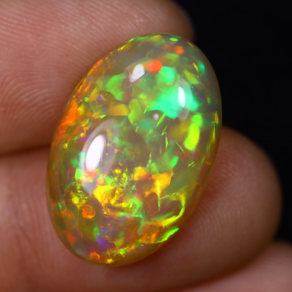 *8.11Ct Welo Opal Polished - Ethiopian Opal , 448C: Ksmith Heritage Auctioneers Subject: Natural Ethiopian Welo Opal Origin: Ethiopia Carat Weight: 8.11Ct Dimension: 21.2x14.1x5.6 mm Treatment: Natural Untreated Type: Caboc