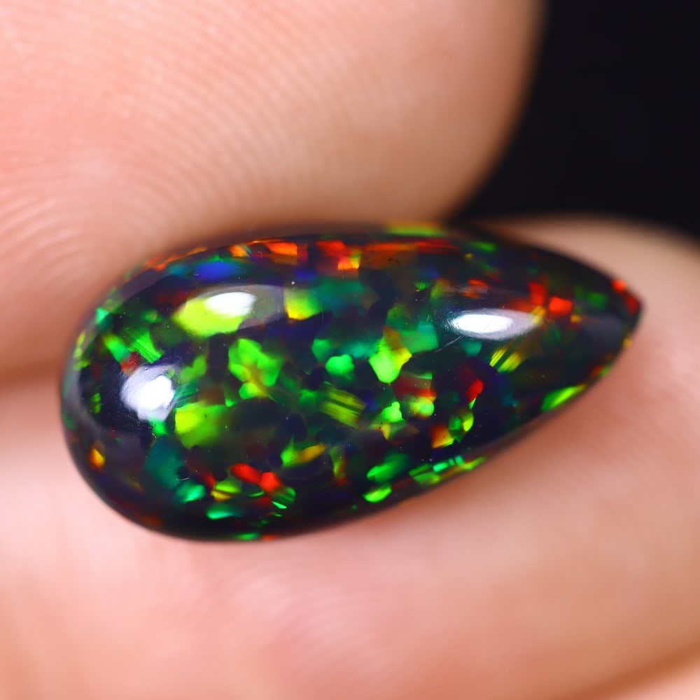 5.19Ct Natural Ethiopian Black Opal - 16.2x8.5x7.6 mm , 604C: Ksmith Heritage Auctioneers Subject: Natural Ethiopian Welo Opal Origin: Ethiopia Treatment: Smoked