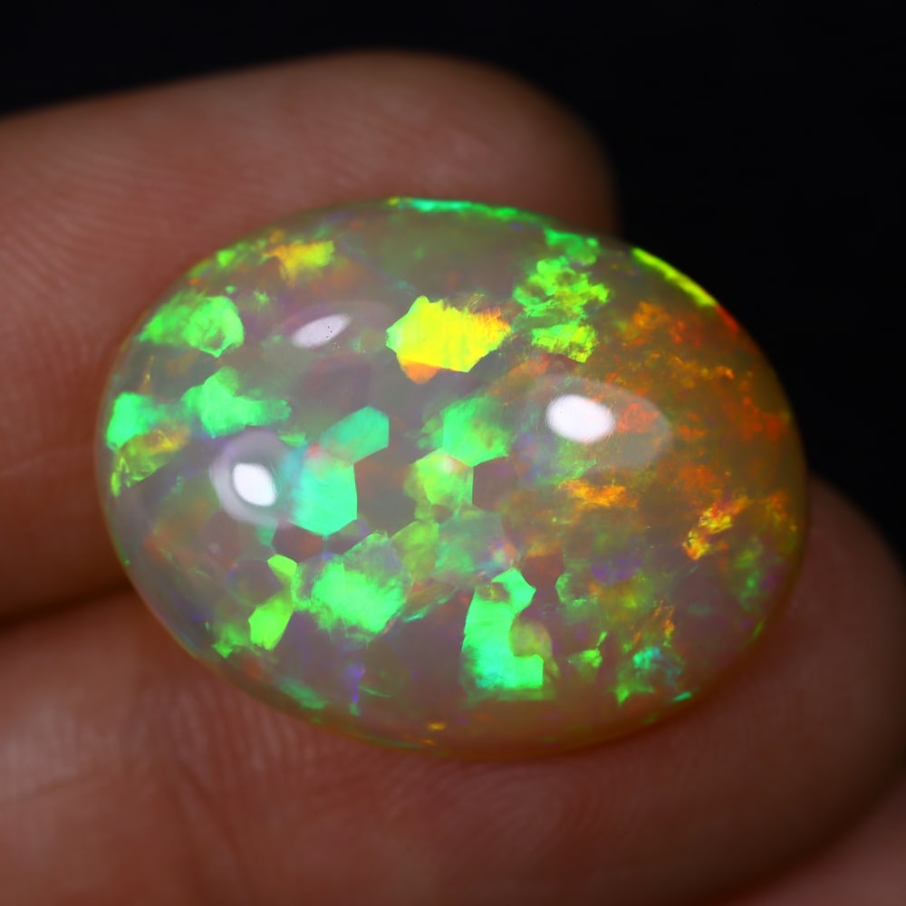 *11.25Ct Welo Opal Polished - Ethiopian Opal , 450C: Ksmith Heritage Auctioneers Subject: Natural Ethiopian Welo Opal Origin: Ethiopia Carat Weight: 11.25Ct Dimension: 21.9x17.1x6.7 mm Treatment: Natural Untreated Type: Cabo