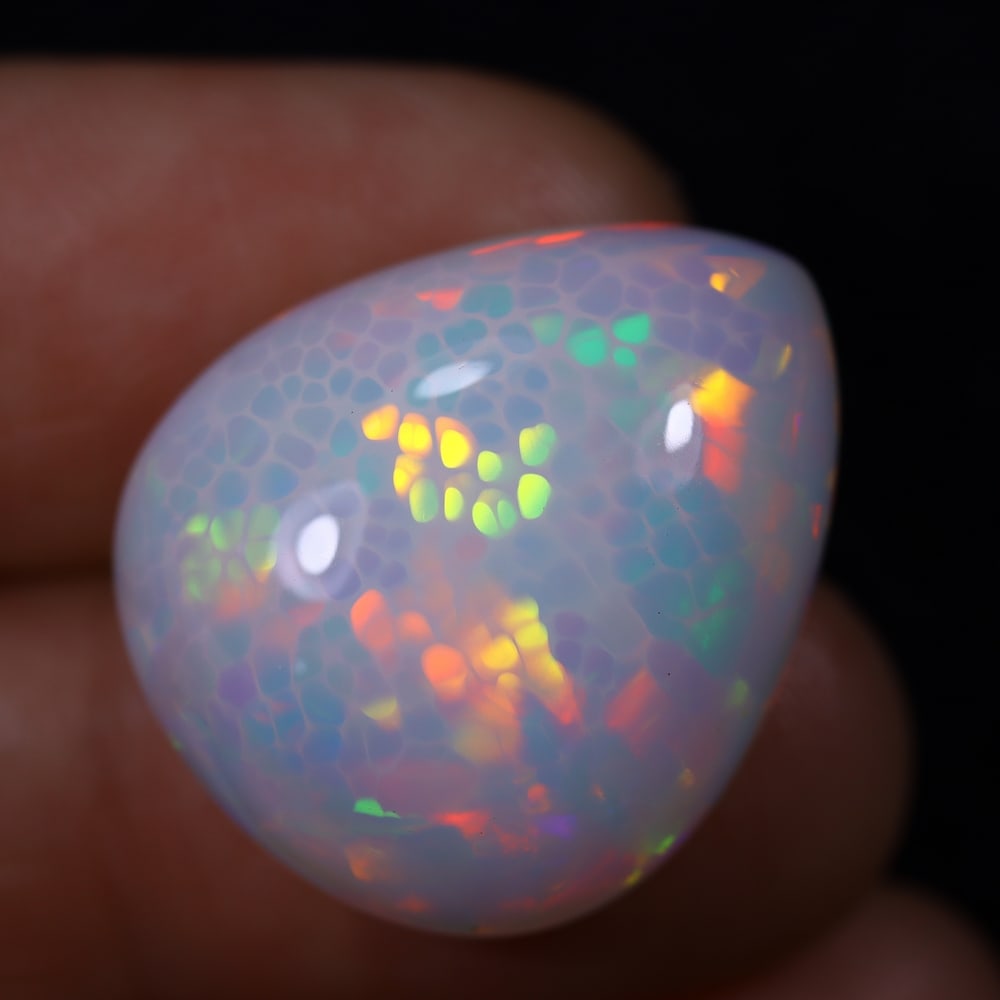 *23.98Ct Unheated Welo Opal Polished - Ethiopian Opal , 442E: Ksmith Heritage Auctioneers Subject: Natural Ethiopian Welo Opal Origin: Ethiopia Carat Weight: 23.98Ct Dimension: 22.7x19.2x11.4 mm Treatment: Natural Untreated Type: Ca