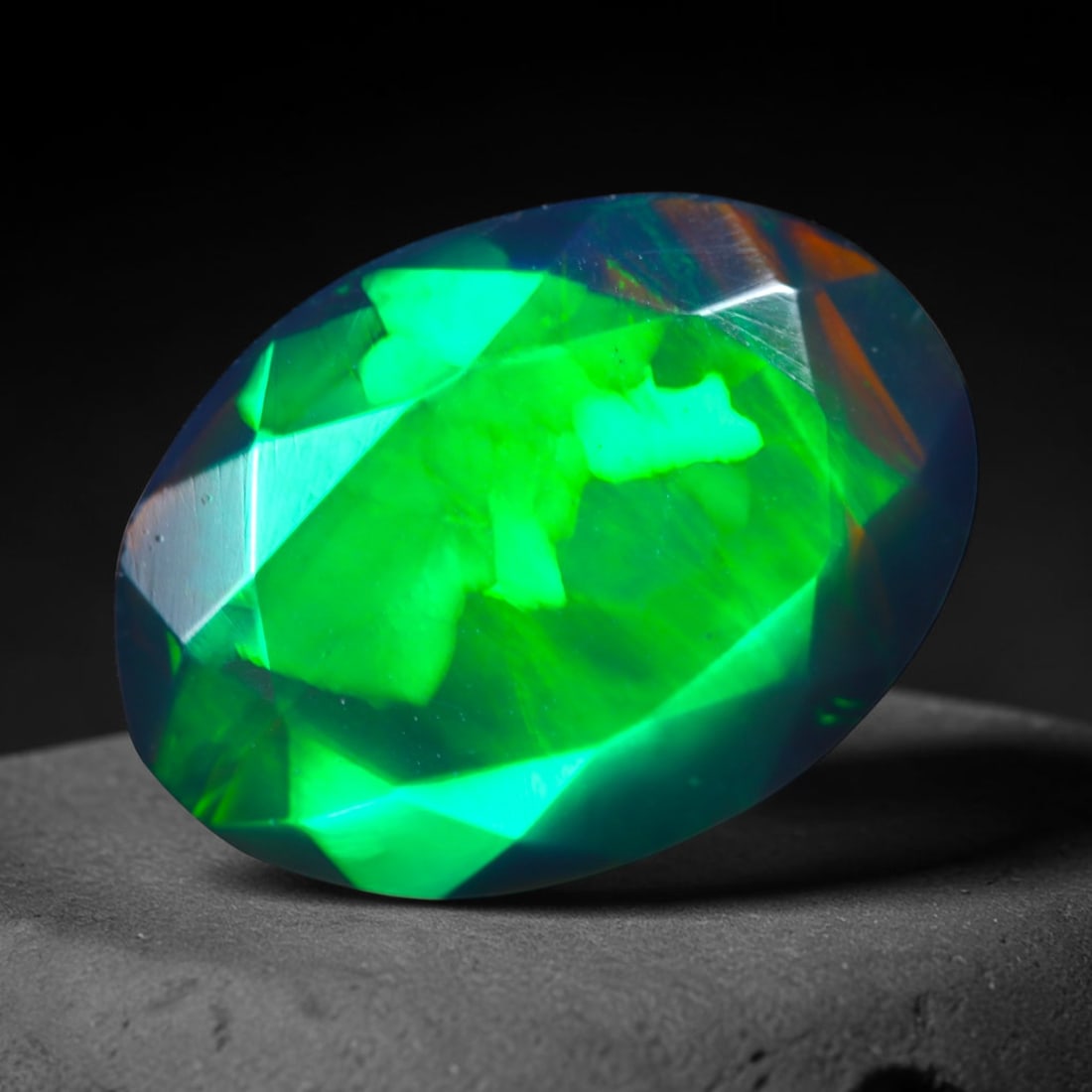 1.93Ct Natural Smoked Ethiopian Black Opal, Faceted Cut - 11.0x8.0x5.2 mm , 693C: Ksmith Heritage Auctioneers Subject: Natural Ethiopian Welo Opal Origin: Ethiopia Treatment: Smoked