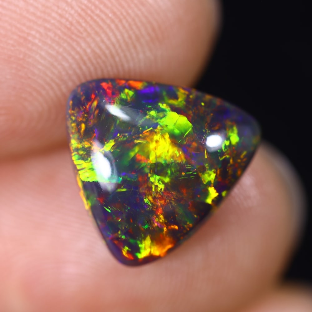 2.55Ct Natural Ethiopian Black Opal - 12.2x11.6x4.0 mm , 591C: Ksmith Heritage Auctioneers Subject: Natural Ethiopian Welo Opal Origin: Ethiopia Treatment: Smoked