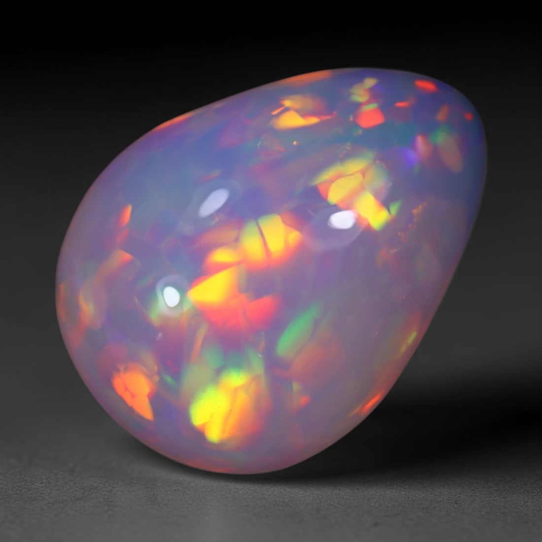 *11.65Ct Welo Opal Polished - Ethiopian Opal , 867E: Ksmith Heritage Auctioneers Subject: Natural Ethiopian Welo Opal Origin: Ethiopia Carat Weight: 11.65Ct Dimension: 20x15x8 mm Treatment: Natural Untreated Type: Cabochon,