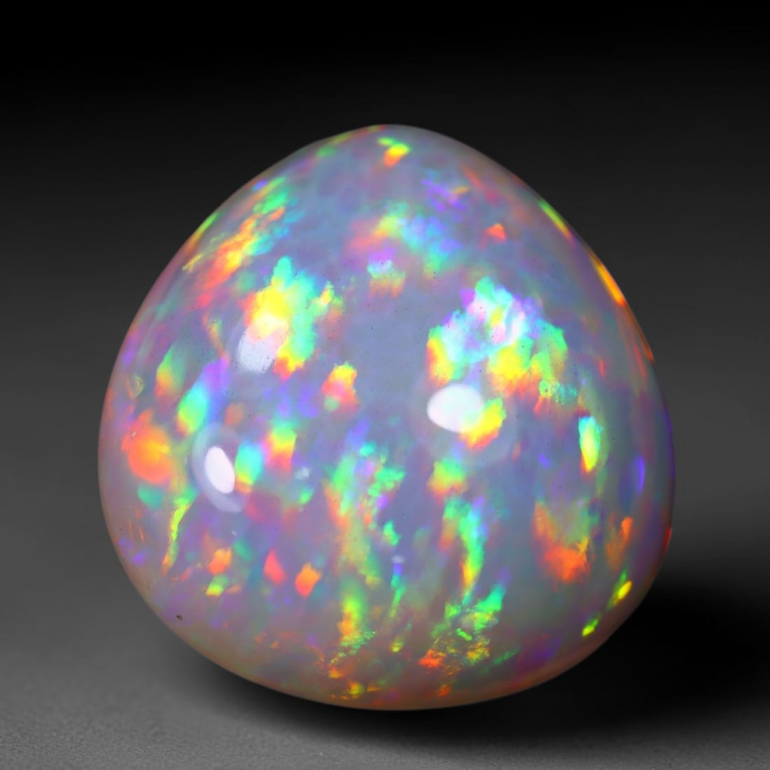 *24.06Ct Welo Opal Polished - Ethiopian Opal , 528E: Ksmith Heritage Auctioneers Subject: Natural Ethiopian Welo Opal Origin: Ethiopia Carat Weight: 24.06Ct Dimension: 21.3x21x11.4 mm Treatment: Natural Untreated Type: Caboc