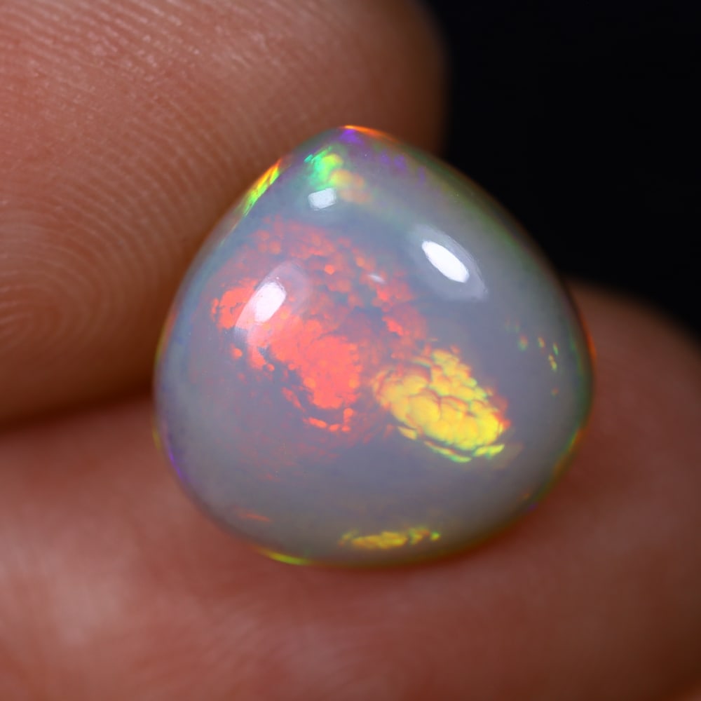 *3.95Ct Welo Opal Polished - Ethiopian Opal , 458C: Ksmith Heritage Auctioneers Subject: Natural Ethiopian Welo Opal Origin: Ethiopia Carat Weight: 3.95Ct Dimension: 12.6x12.5x5.5 mm Treatment: Natural Untreated Type: Caboc