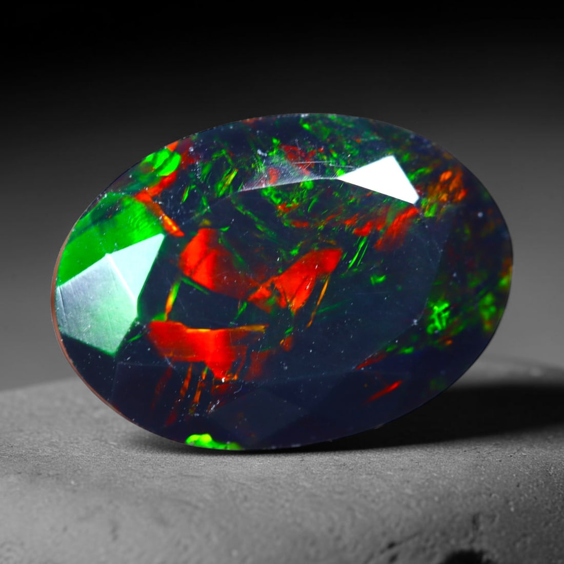 2.66Ct Natural Smoked Ethiopian Black Opal, Faceted Cut - 12.7x9.2x6.3 mm , 697C: Ksmith Heritage Auctioneers Subject: Natural Ethiopian Welo Opal Origin: Ethiopia Treatment: Smoked