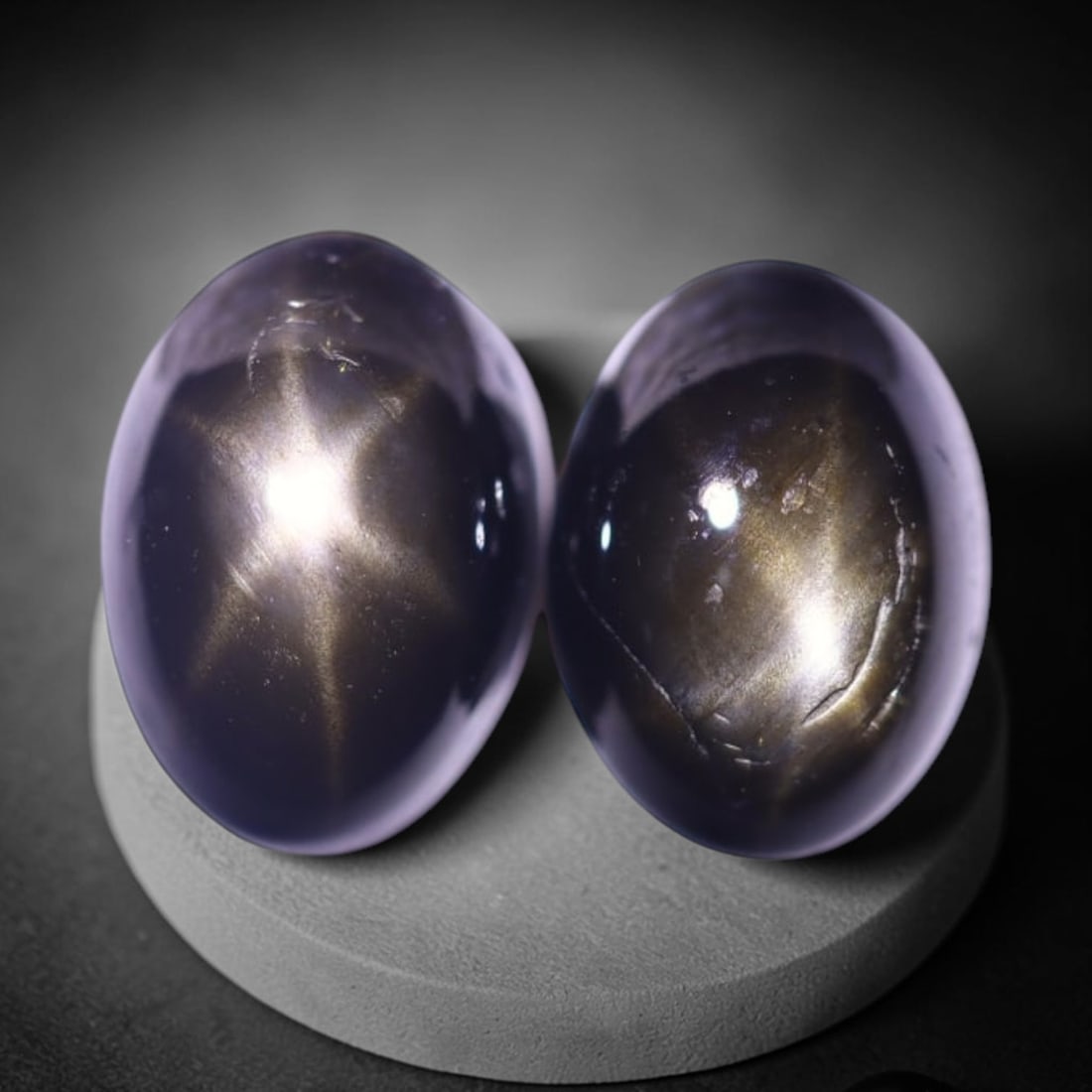 2.75cts 6 Rays Black Star Sapphire Pair , 518E: Ksmith Heritage Auctioneers Subject: Natural 6 Rays Star Sapphire Origin: Myanmar Carat Weight: 2.75cts Dimension: 6.9x5x3.9 mm Treatment: Diffusion Type: Cabochon, Polish