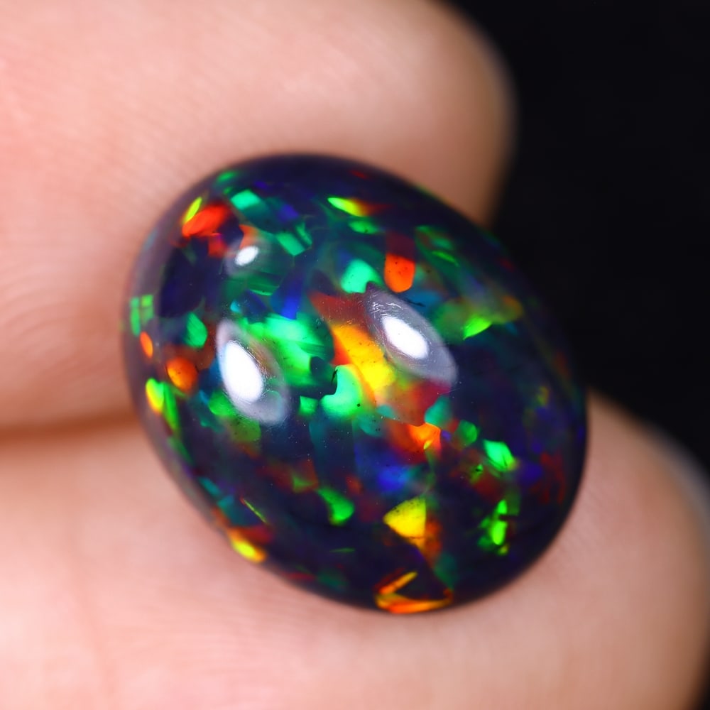 4.64Ct Natural Ethiopian Black Opal - 14.4x11.4x6.3 mm , 578C: Ksmith Heritage Auctioneers Subject: Natural Ethiopian Welo Opal Origin: Ethiopia Treatment: Smoked