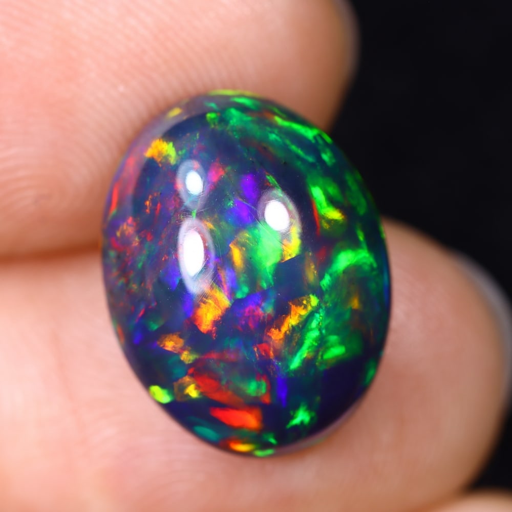 5.07Ct Natural Ethiopian Black Opal - 15.0x11.6x6.5 mm , 585C: Ksmith Heritage Auctioneers Subject: Natural Ethiopian Welo Opal Origin: Ethiopia Treatment: Smoked