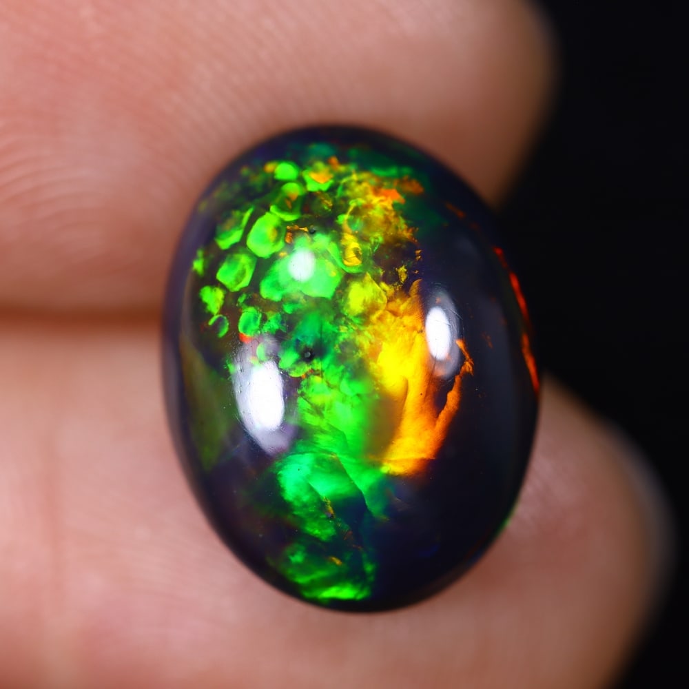 4.48Ct Natural Ethiopian Black Opal - 14.6x11.2x5.8 mm , 606C: Ksmith Heritage Auctioneers Subject: Natural Ethiopian Welo Opal Origin: Ethiopia Treatment: Smoked
