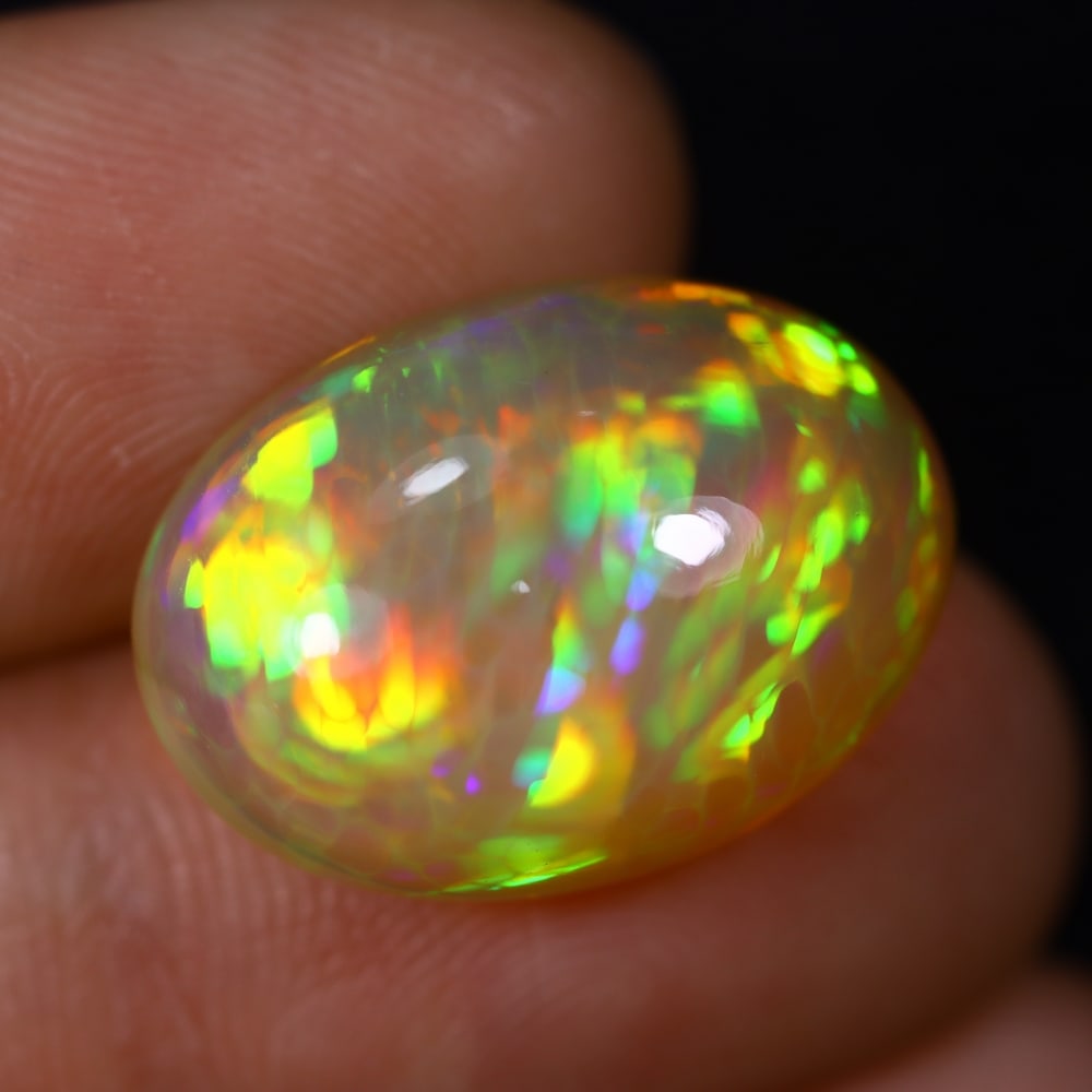 *11.56Ct Welo Opal Polished - Ethiopian Opal , 442C: Ksmith Heritage Auctioneers Subject: Natural Ethiopian Welo Opal Origin: Ethiopia Carat Weight: 11.56Ct Dimension: 19.5x13.8x9 mm Treatment: Natural Untreated Type: Caboch