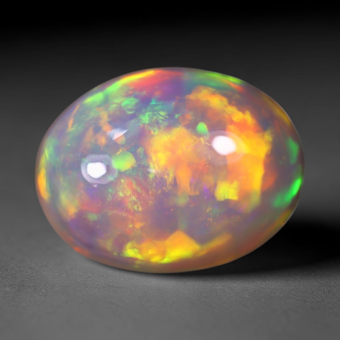 *6.63Ct Welo Opal Polished - Ethiopian Opal , 398C: Ksmith Heritage Auctioneers Subject: Natural Ethiopian Welo Opal Origin: Ethiopia Carat Weight: 6.63Ct Dimension: 14.4x11x8.1 mm Treatment: Natural Untreated Type: Cabocho