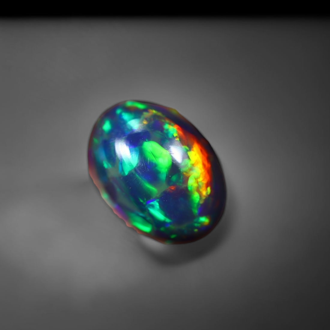 *1.75Ct Smoked Welo Opal Polished - Ethiopian Opal , 310C: Ksmith Heritage Auctioneers Subject: Natural Ethiopian Welo Opal Origin: Ethiopia Carat Weight: 1.75Ct Dimension: 10.5x7.6x4.3 mm Treatment: Smoked Type: Cabochon, Polishe