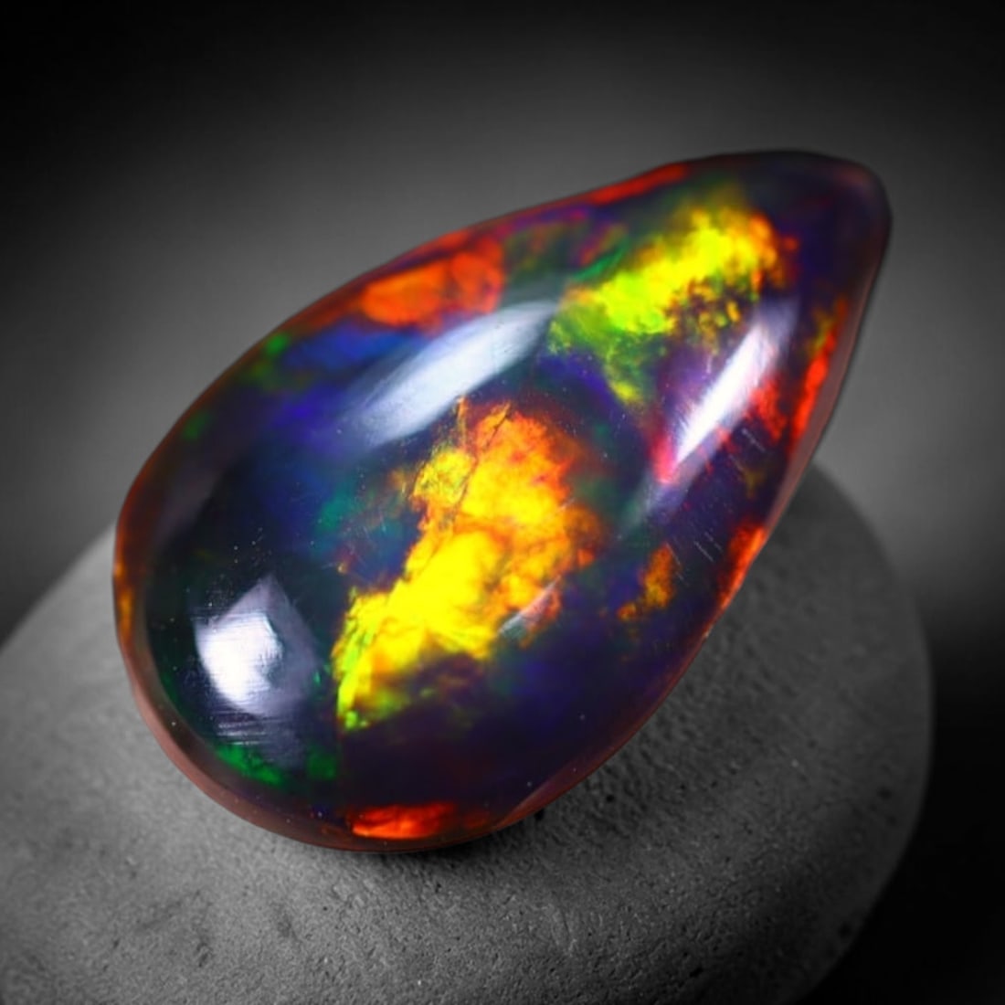 *1.20Ct Smoked Welo Opal Polished - Ethiopian Opal , 308C: Ksmith Heritage Auctioneers Subject: Natural Ethiopian Welo Opal Origin: Ethiopia Carat Weight: 1.20Ct Dimension: 12.3x7.7x2.6 mm Treatment: Smoked Type: Cabochon, Polishe