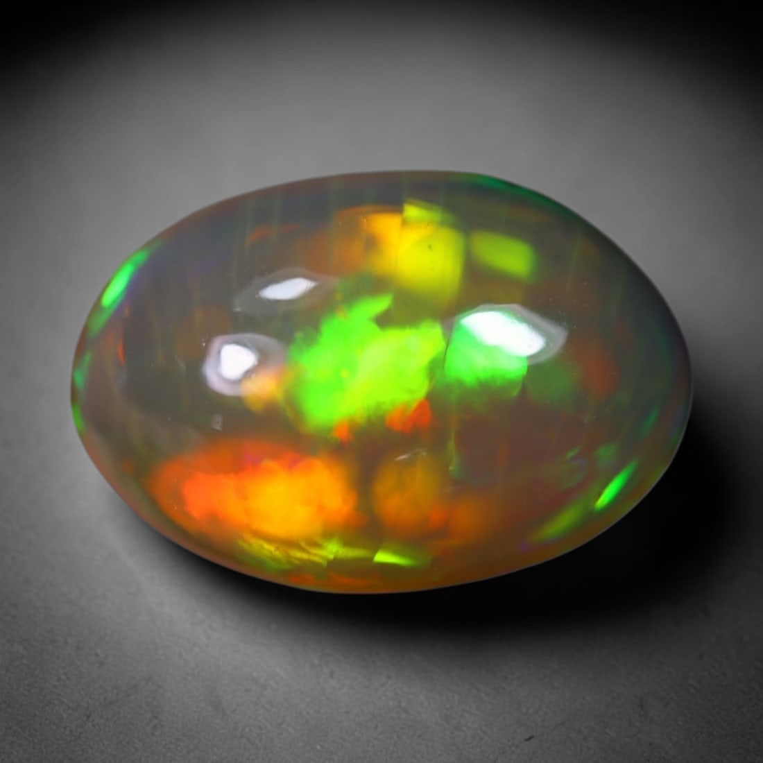 *4.85Ct Welo Opal Polished - Ethiopian Opal , 514E: Ksmith Heritage Auctioneers Subject: Natural Ethiopian Welo Opal Origin: Ethiopia Carat Weight: 4.85Ct Dimension: 14.4x10.6x6.8 mm Treatment: Natural Untreated Type: Caboc