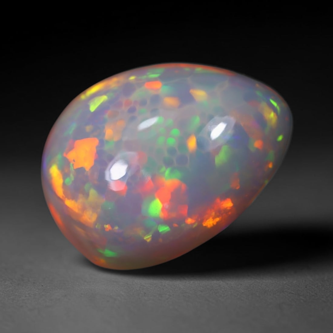 *8.35Ct Welo Opal Polished - Ethiopian Opal , 77E: Ksmith Heritage Auctioneers Subject: Natural Ethiopian Welo Opal Origin: Ethiopia Carat Weight: 8.35Ct Dimension: 16.7x13.3x8.6 mm Treatment: Natural Untreated Type: Caboc