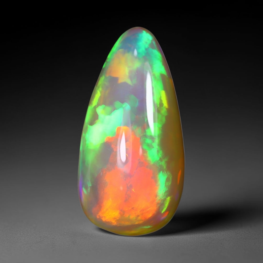 *12.78Ct Teardrop Welo Opal - Ethiopian Opal, 378C: Ksmith Heritage Auctioneers Subject: Natural Ethiopian Welo Opal Origin: Ethiopia Carat Weight: 12.78Ct Dimension: 22.2x11.3x10 mm Treatment: Natural Untreated Type: Cabochon,
