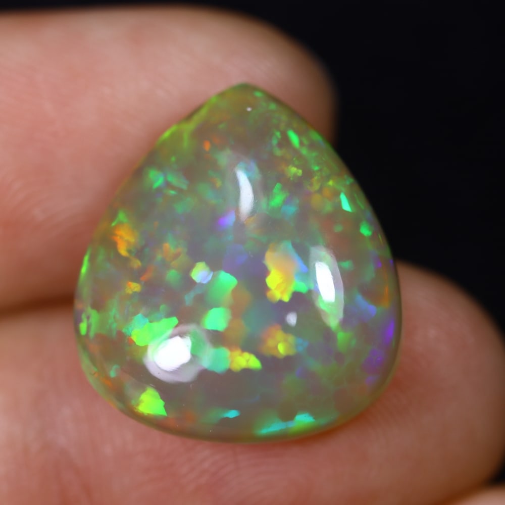*11.13Ct Welo Opal Polished - Ethiopian Opal , 436C: Ksmith Heritage Auctioneers Subject: Natural Ethiopian Welo Opal Origin: Ethiopia Carat Weight: 11.13Ct Dimension: 18.2x16.3x7.5 mm Treatment: Natural Untreated Type: Cabo