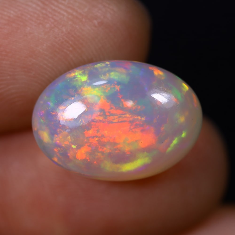 *7.81Ct Welo Opal Polished - Ethiopian Opal , 420C: Ksmith Heritage Auctioneers Subject: Natural Ethiopian Welo Opal Origin: Ethiopia Carat Weight: 7.81Ct Dimension: 16.2x11.6x8.1 mm Treatment: Natural Untreated Type: Caboc