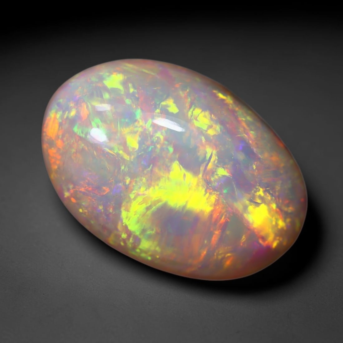 6.43Ct Welo Opal Polished - Ethiopian Opal, 709B: Ksmith Heritage Auctioneers Subject: Natural Ethiopian Welo Opal Origin: Ethiopia Carat Weight: 6.43Ct Dimension: 15.5x10.4x7.6 mm Treatment: Natural Untreated Type: Cabochon,