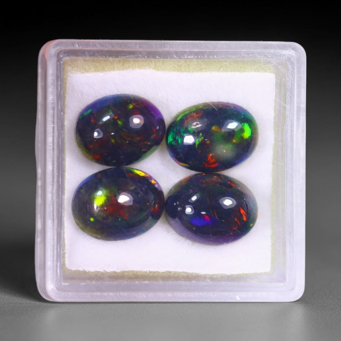 6.29Ct Welo Black Opal Polished Lot - Ethiopian Opal , 963E: Ksmith Heritage Auctioneers Subject: Natural Ethiopian Welo Black Opal Origin: Ethiopia Carat Weight: 6.29Ct Dimension: 9.9x7.7x4.4 mm Treatment: Smoked Type: Cabochon, Po