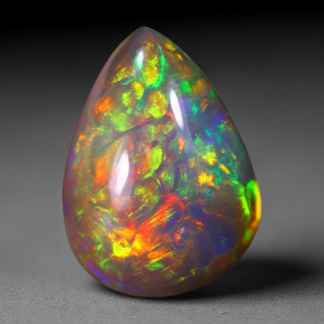 *14.58Ct Dark Base Snake Skin Welo Opal Polished - Ethiopian Opal , 144E: Ksmith Heritage Auctioneers Subject: Natural Ethiopian Welo Opal Origin: Ethiopia Carat Weight: 14.58Ct Dimension: 22.1x15.9x9.1 mm Treatment: Natural Untreated Type: Cabo