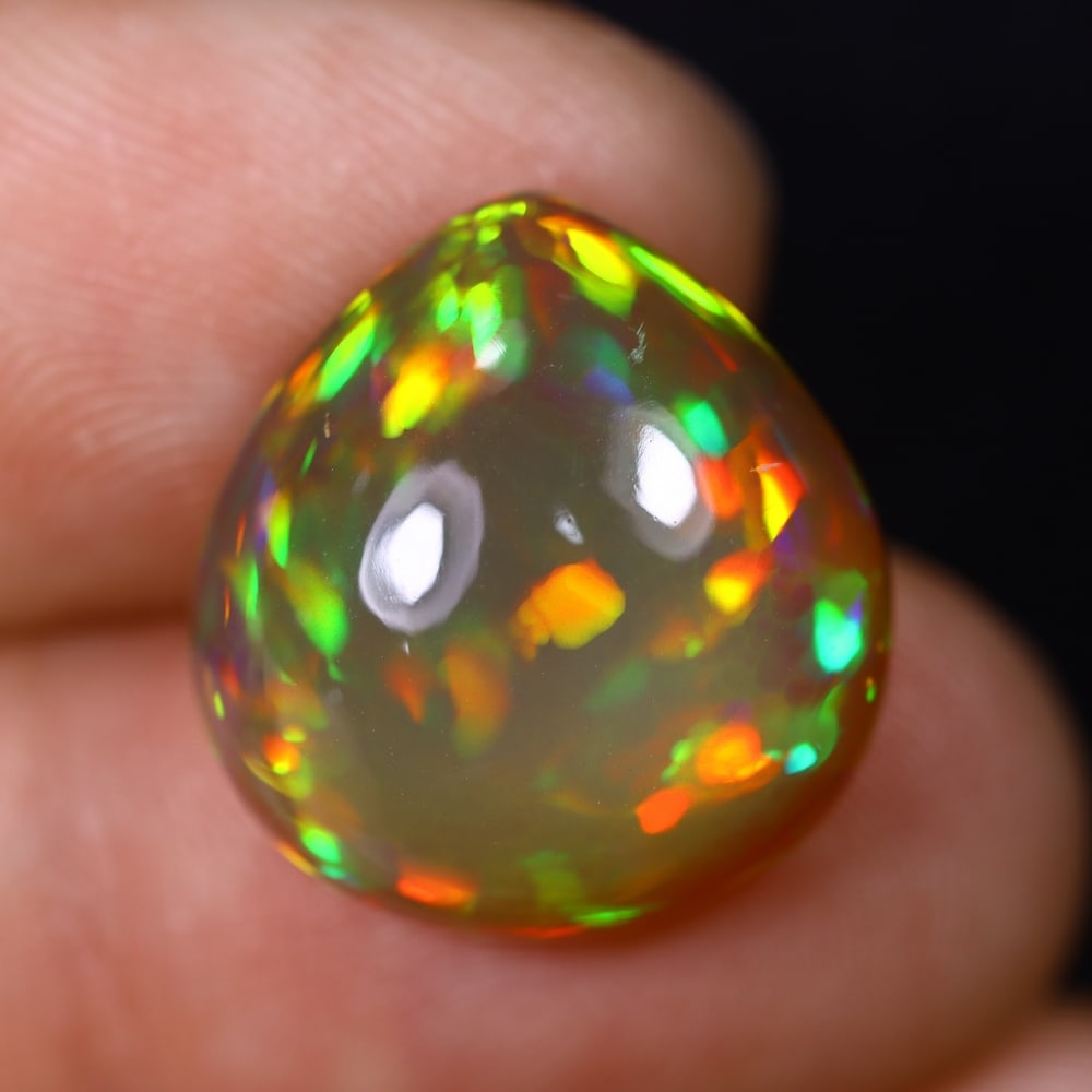 *10.02Ct Welo Opal Polished - Ethiopian Opal , 422C: Ksmith Heritage Auctioneers Subject: Natural Ethiopian Welo Opal Origin: Ethiopia Carat Weight: 10.02Ct Dimension: 16.6x15.6x7.6 mm Treatment: Natural Untreated Type: Cabo