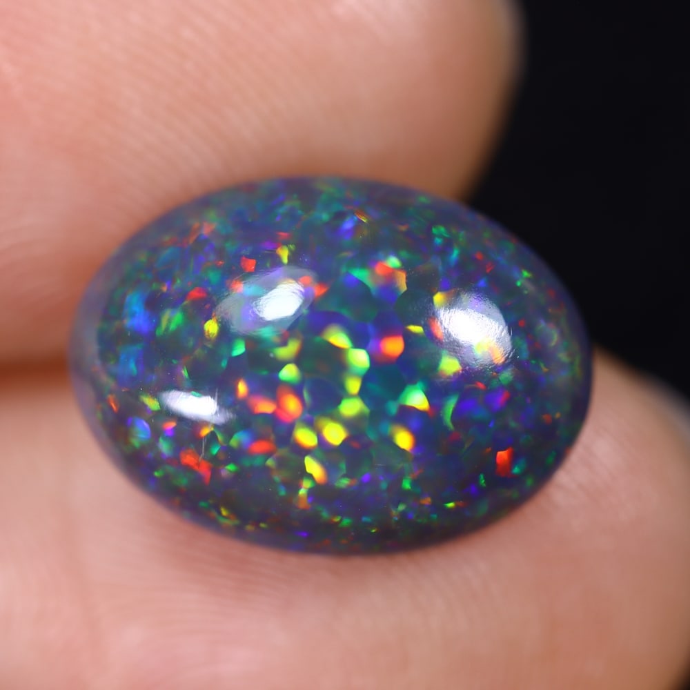 4.77Ct Natural Ethiopian Black Opal - 14.7x10.6x6.1 mm , 574C: Ksmith Heritage Auctioneers Subject: Natural Ethiopian Welo Opal Origin: Ethiopia Treatment: Smoked