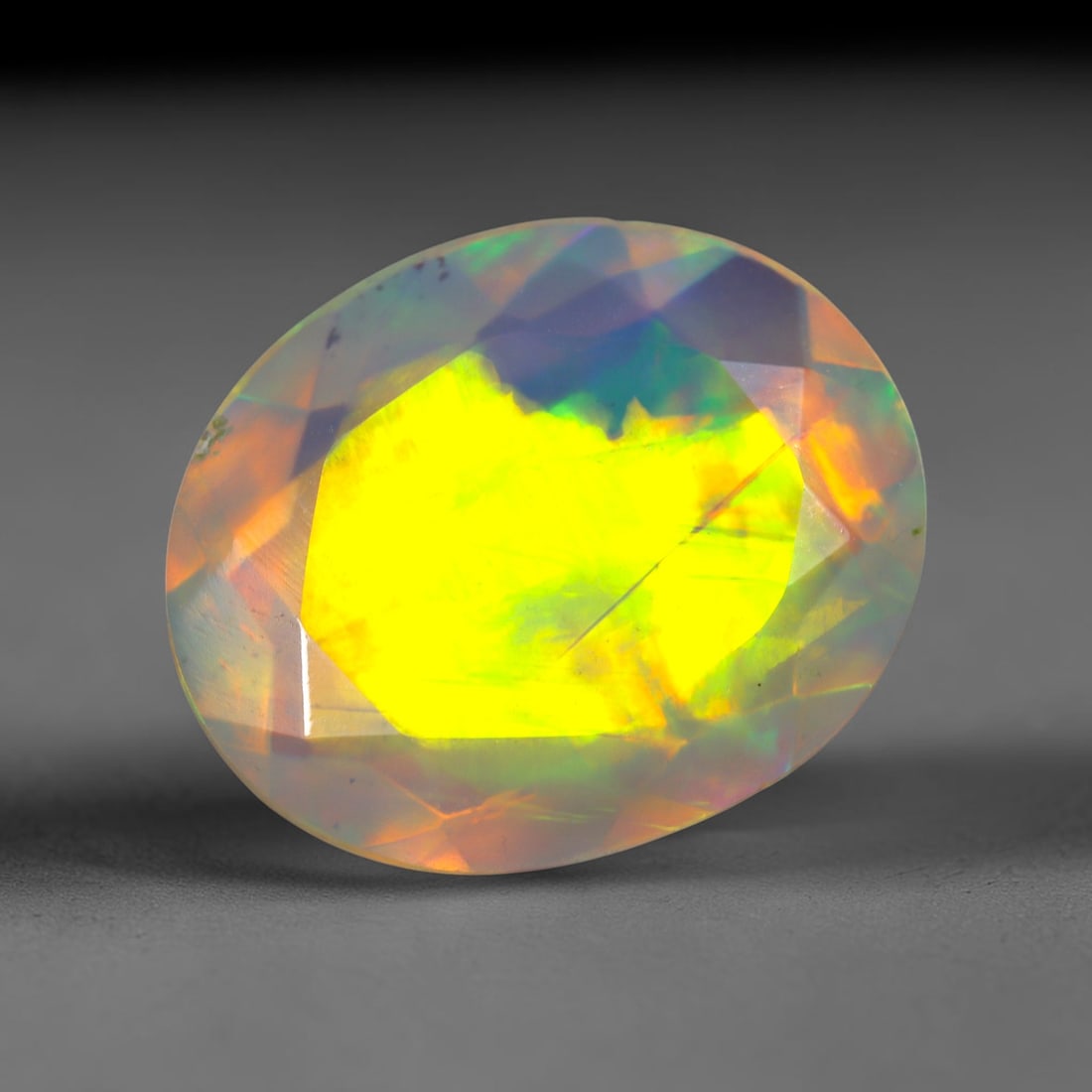 2.52Ct Natural Ethiopian Opal, Faceted Cut - 12.1x10.0x5.1 mm , 689C: Ksmith Heritage Auctioneers Subject: Natural Ethiopian Welo Opal Origin: Ethiopia Treatment: Unheated