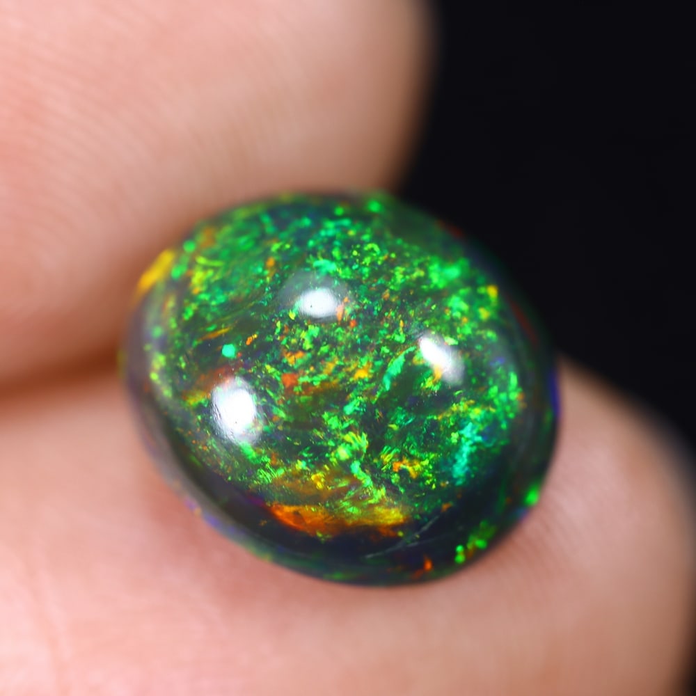 3.52Ct Natural Ethiopian Black Opal - 12.2x10.5x5.6 mm , 593C: Ksmith Heritage Auctioneers Subject: Natural Ethiopian Welo Opal Origin: Ethiopia Treatment: Smoked