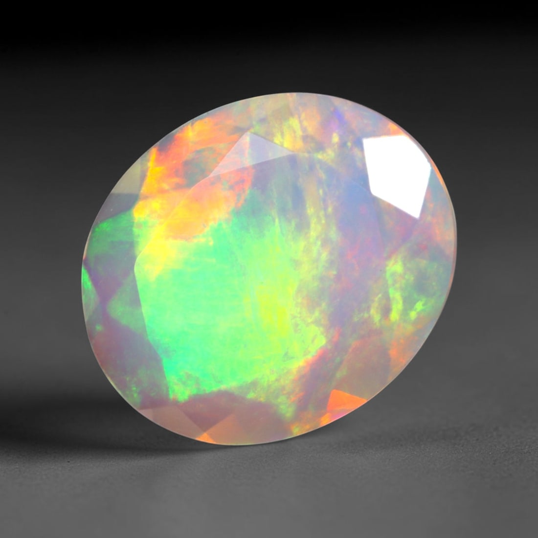 2.06Ct Natural Ethiopian Opal, Faceted Cut - 11.9x10.0x4.3 mm , 640C: Ksmith Heritage Auctioneers Subject: Natural Ethiopian Welo Opal Origin: Ethiopia Treatment: Unheated