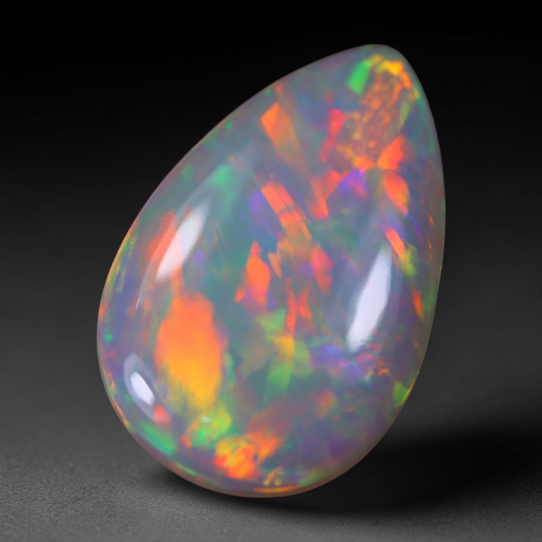 *11.35Ct Welo Opal Polished - Ethiopian Opal, 1169B: Ksmith Heritage Auctioneers Subject: Natural Ethiopian Welo Opal Origin: Ethiopia Carat Weight: 11.35Ct Dimension: 21.2x14x7.8 mm Treatment: Natural Untreated Type: Cabochon, P