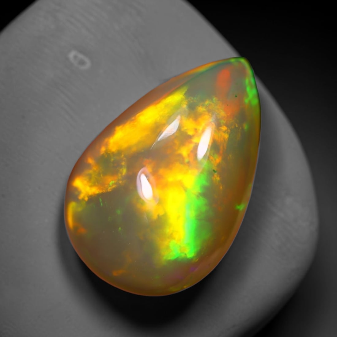 *3.85Ct Welo Opal Polished - Ethiopian Opal , 213E: Ksmith Heritage Auctioneers Subject: Natural Ethiopian Welo Opal Origin: Ethiopia Carat Weight: 3.85Ct Dimension: 15.1x10.5x5.4 mm Treatment: Natural Untreated Type: Facet