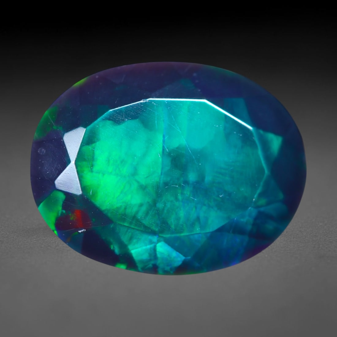 4.01Ct Natural Smoked Ethiopian Black Opal, Faceted Cut - 14.2x10.9x5.8 mm , 708C: Ksmith Heritage Auctioneers Subject: Natural Ethiopian Welo Opal Origin: Ethiopia Treatment: Smoked