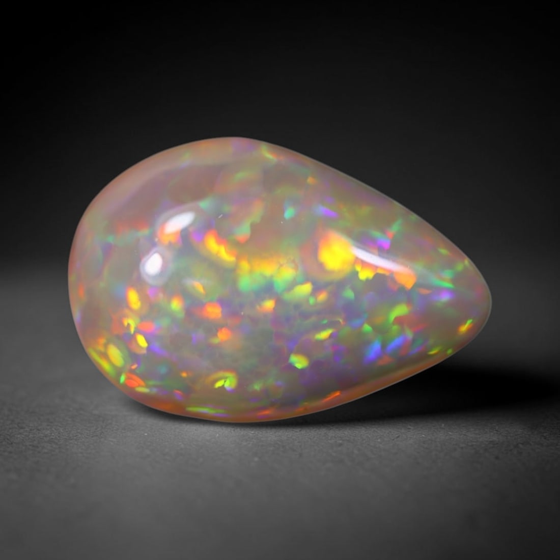 *4.07Ct Welo Opal Polished - Ethiopian Opal, 590B: Ksmith Heritage Auctioneers Subject: Natural Ethiopian Welo Opal Origin: Ethiopia Carat Weight: 4.07Ct Dimension: 15.7x10.6x5.7 mm Treatment: Natural Untreated Type: Cabochon,