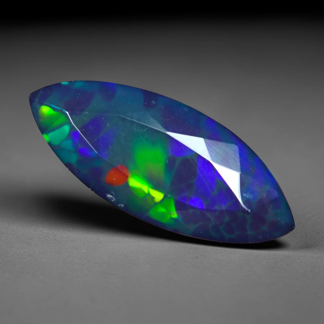 3.47Ct Natural Smoked Ethiopian Black Opal, Faceted Cut - 18.4x7.7x5.8 mm , 710C: Ksmith Heritage Auctioneers Subject: Natural Ethiopian Welo Opal Origin: Ethiopia Treatment: Smoked