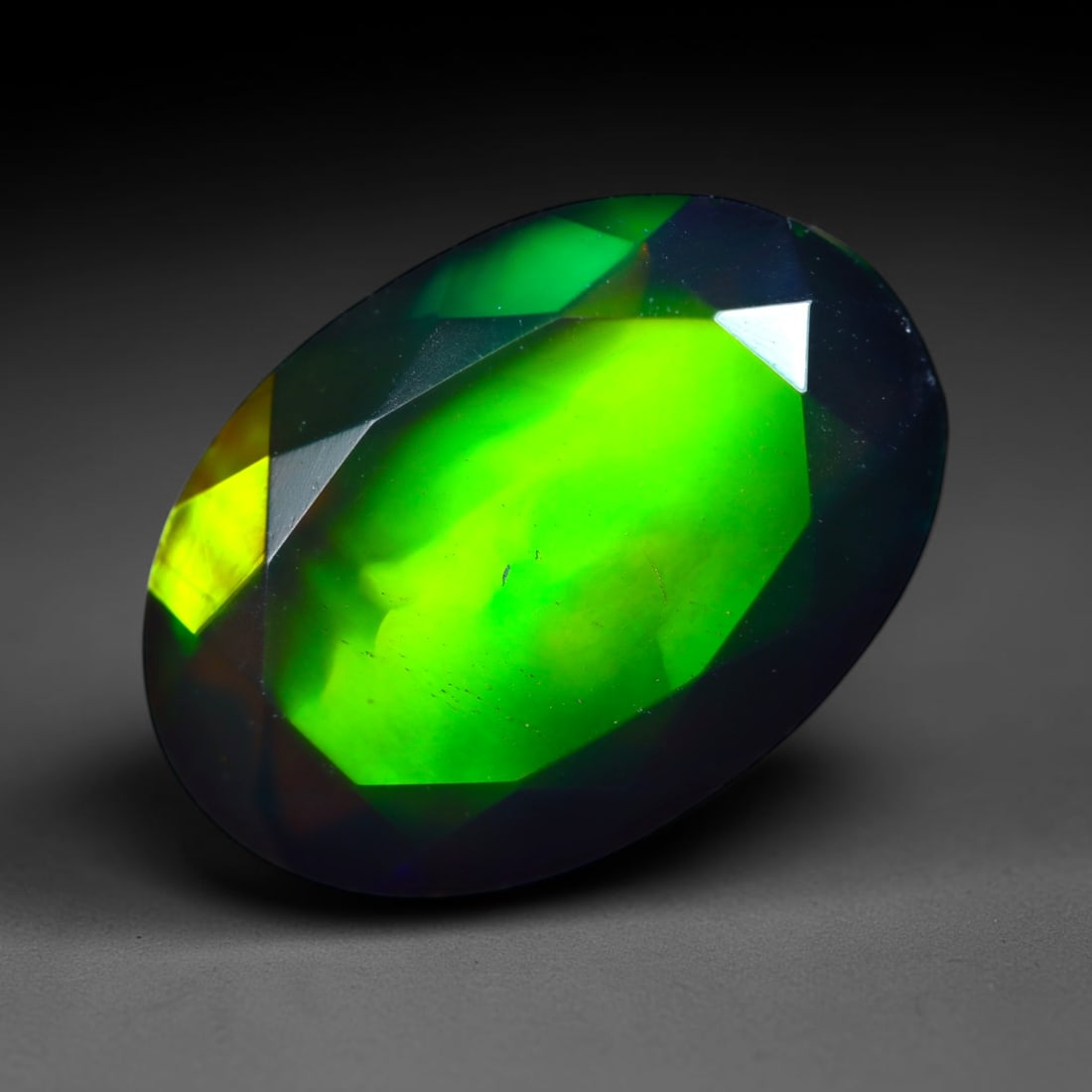 2.11Ct Natural Smoked Ethiopian Black Opal, Faceted Cut - 11.4x8.0x5.1 mm , 724C: Ksmith Heritage Auctioneers Subject: Natural Ethiopian Welo Opal Origin: Ethiopia Treatment: Smoked