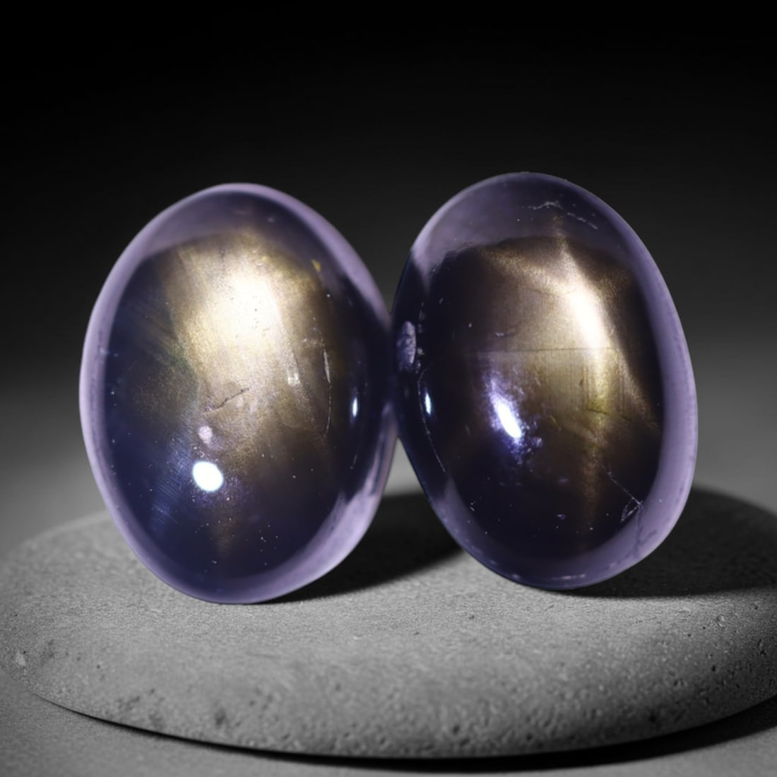 2.82cts 6 Rays Black Star Sapphire Pair , 818E: Ksmith Heritage Auctioneers Subject: Natural 6 Rays Star Sapphire Origin: Myanmar Carat Weight: 2.82cts Dimension: 7x5x3.4 mm Treatment: Diffusion Type: Cabochon, Polished
