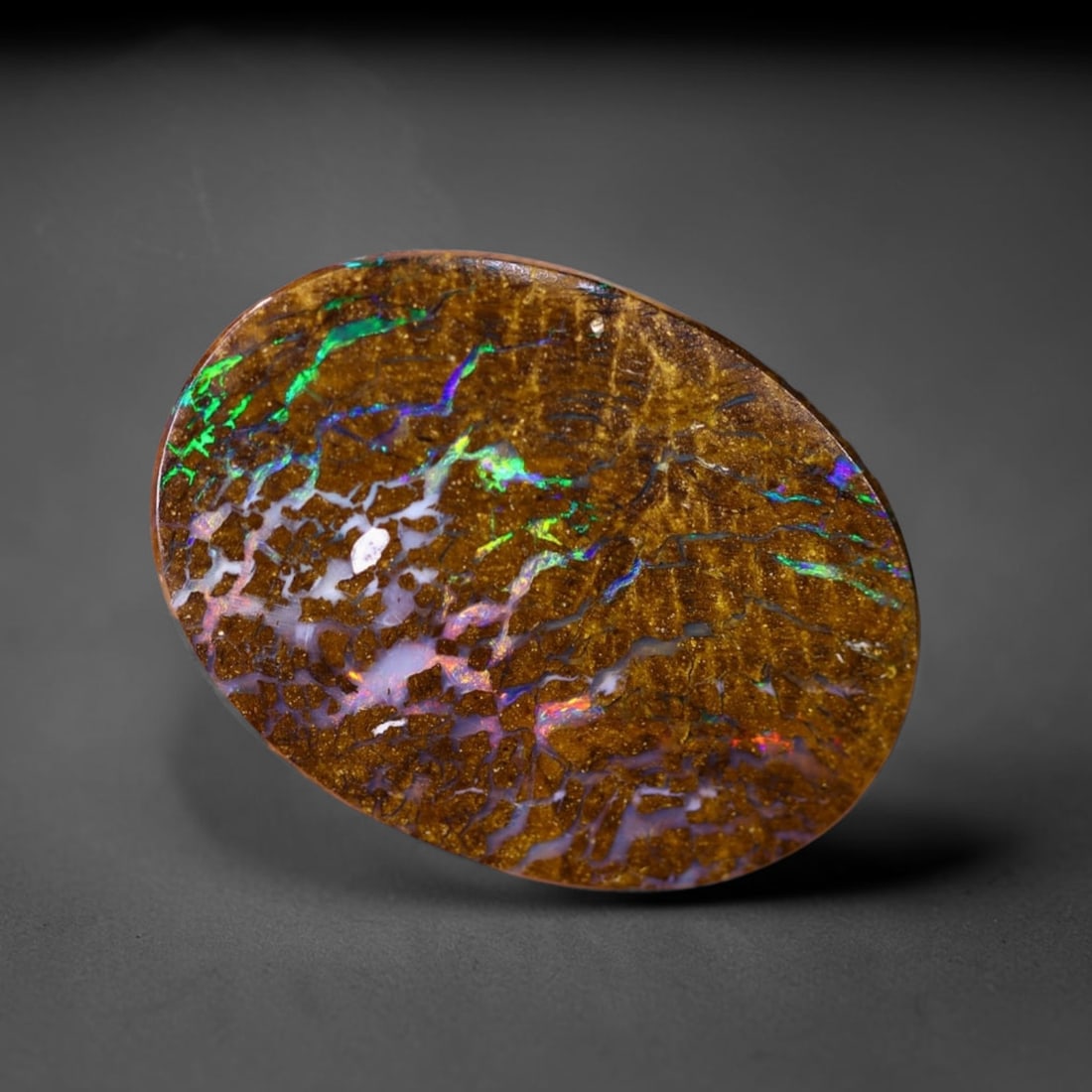 *9.15Ct Boulder Opal - Australian Opal , 199C: Ksmith Heritage Auctioneers Subject: Natural Boulder Opal Origin: Australia Carat Weight: 9.15Ct Dimension: 20.5x15.3x3.2 mm Treatment: Natural Untreated Type: Cabochon, P