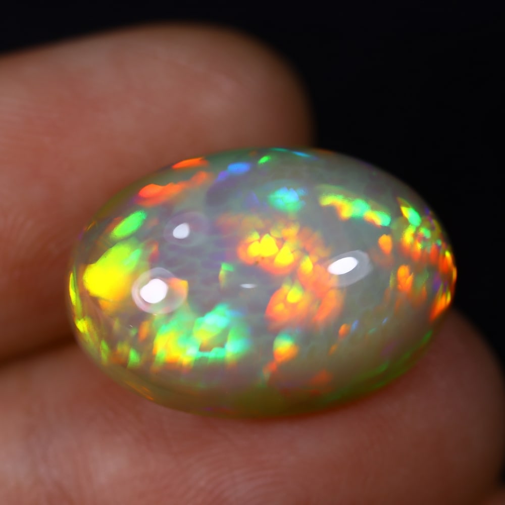 *13.34Ct Welo Opal Polished - Ethiopian Opal , 443C: Ksmith Heritage Auctioneers Subject: Natural Ethiopian Welo Opal Origin: Ethiopia Carat Weight: 13.34Ct Dimension: 19.3x13.3x9.1 mm Treatment: Natural Untreated Type: Cabo