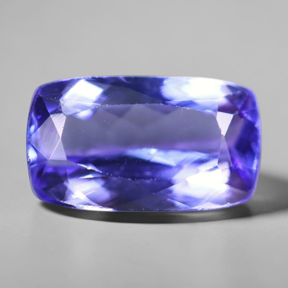 1.99Ct Tanzanite Faceted - Rectangle Polished , 167B: Ksmith Heritage Auctioneers Subject: Natural Tanzanite Origin: Tanzania Dimension: 9.9x5.7x3.8 mm Treatment: Heated Shape: Rectangle Type: Faceted, Polished