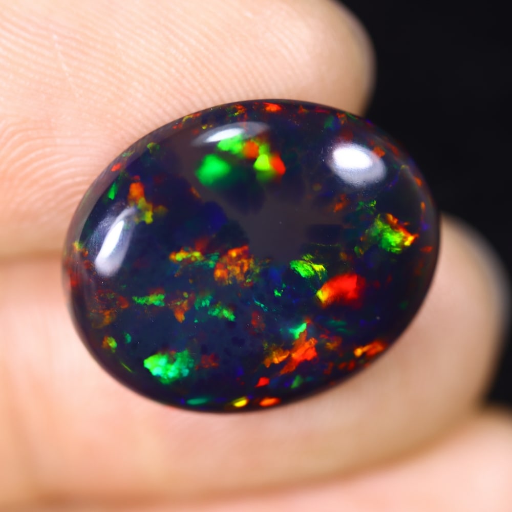 6.87Ct Natural Ethiopian Black Opal - 18.1x15.0x5.0 mm , 618C: Ksmith Heritage Auctioneers Subject: Natural Ethiopian Welo Opal Origin: Ethiopia Treatment: Smoked