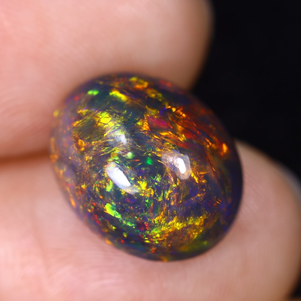6.11Ct Natural Ethiopian Black Opal - 14.2x11.4x7.9 mm , 571C: Ksmith Heritage Auctioneers Subject: Natural Ethiopian Welo Opal Origin: Ethiopia Treatment: Smoked