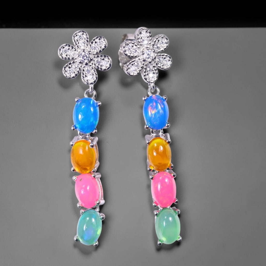 Earrings Color Opal - 925 Sterling Silver - Plated 14K White Gold , 980E: Ksmith Heritage Auctioneers Subject: Natural Blue, Orange, Pink and Green Opal Origin: Thailand Carat Weight: 3.86g Dimension: Gemstone 4x6mm Type: Earrings