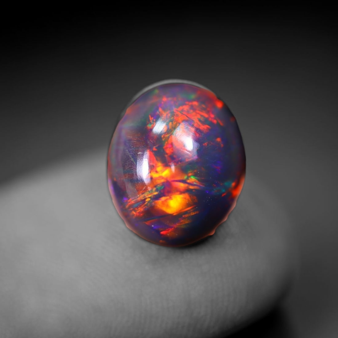 *1.64Ct Smoked Welo Opal Polished - Ethiopian Opal , 304C: Ksmith Heritage Auctioneers Subject: Natural Ethiopian Welo Opal Origin: Ethiopia Carat Weight: 1.64Ct Dimension: 10x8.2x4 mm Treatment: Smoked Type: Cabochon, Polished