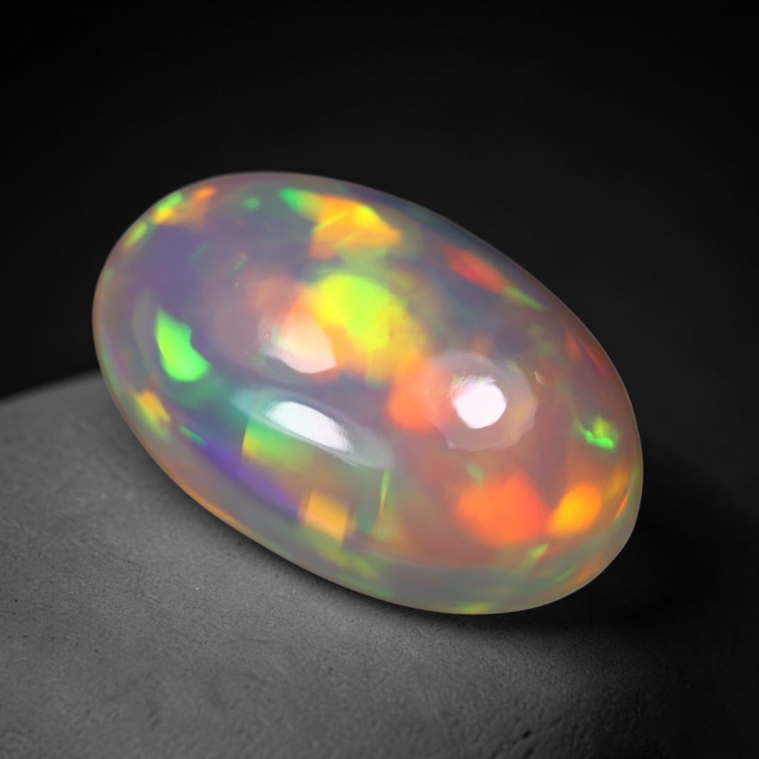 4.81Ct Welo Opal Polished - Ethiopian Opal, 115B: Ksmith Heritage Auctioneers Subject: Natural Ethiopian Welo Opal Origin: Ethiopia Carat Weight: 4.81Ct Dimension: 11.2x10.3x5.5 mm Treatment: Natural Untreated Type: Cabochon,