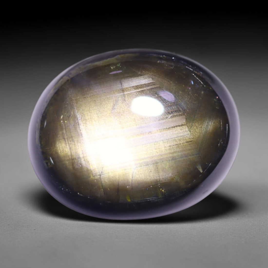 9.07cts 6 Rays Black Star Sapphire , 795E: Ksmith Heritage Auctioneers Subject: Natural 6 Rays Star Sapphire Origin: Myanmar Carat Weight: 9.07cts Dimension: 12.8x10.2x5.3 mm Treatment: Diffusion Type: Cabochon, Po