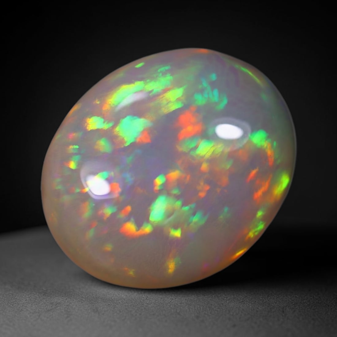 *7.08Ct Welo Opal Polished - Ethiopian Opal , 569E: Ksmith Heritage Auctioneers Subject: Natural Ethiopian Welo Opal Origin: Ethiopia Carat Weight: 7.08Ct Dimension: 16x13.3x6.7 mm Treatment: Natural Untreated Type: Cabocho