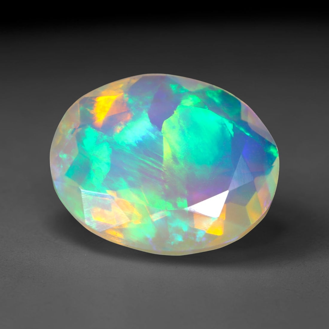 2.35Ct Natural Ethiopian Opal, Faceted Cut - 11.9x10.0x5.1 mm , 646C: Ksmith Heritage Auctioneers Subject: Natural Ethiopian Welo Opal Origin: Ethiopia Treatment: Unheated